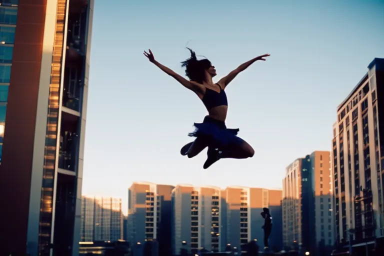 A colorful urban background with a silhouette of a dancer mid-jump in the foreground.