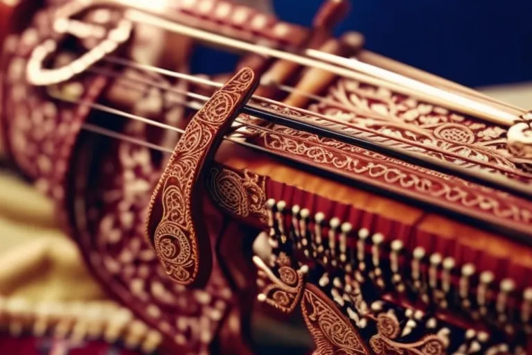 A close-up photo of a traditional musical instrument with intricate carvings and patterns, set against a blurred background of colorful fabrics and textiles.